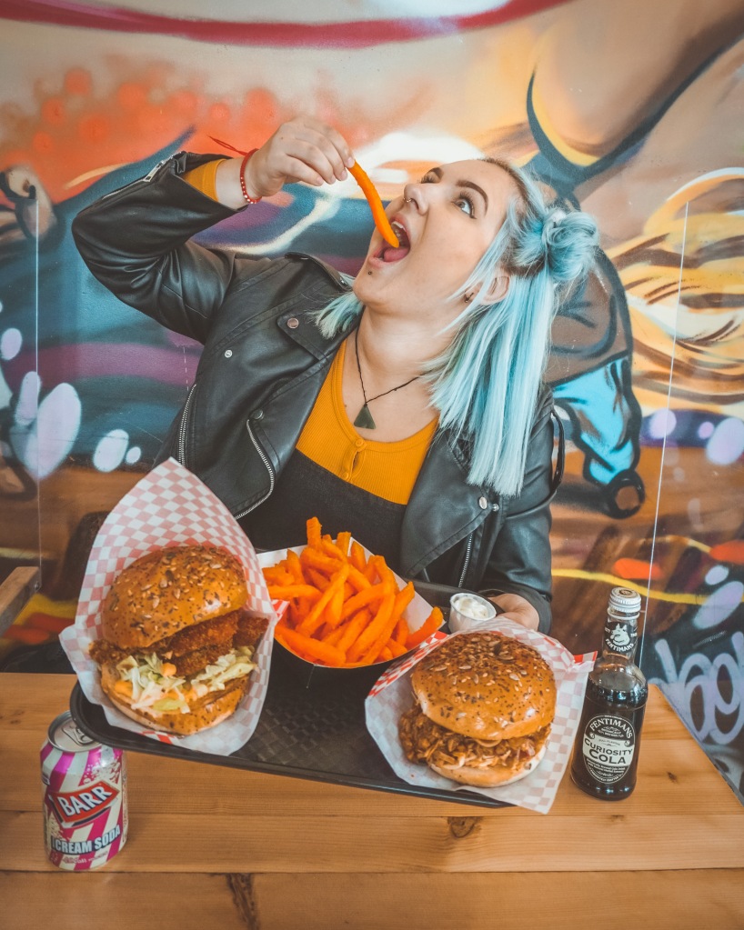 Steff enjoying her vegan burger and fries